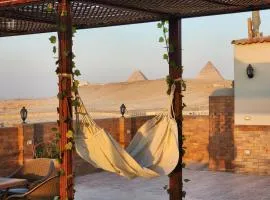 Private rooftop with jacuzzi and pyramids view