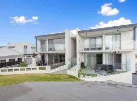 Relax in blissful sun-soaked luxury by the beach