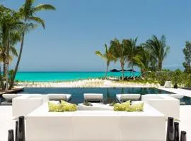 Cool beachfront fully staffed villa with unique architecture
