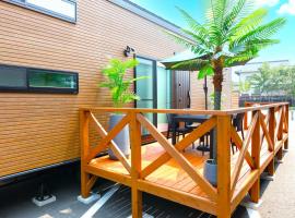 ホテルトレーラーシップガーデン阿蘇, apartamento en Aso