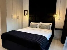 The Monochrome Apartment 209 - Urban Chic Escape - Open Plan Bathroom with Bathtub