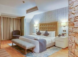 La Abbey Hotel and Suites, hotel con estacionamiento en Mama