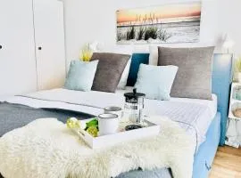 Surfbude, Olpenitz - moderne Ferienwohnung in direkter Strandnähe mit eigenem Eingang, Sauna, Kaminofen, Balkonterrasse und Parkplatz