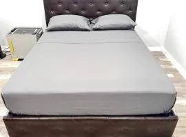 Modern & Cozy Bedroom with Smart TV, Perfect for Relaxing Getaways