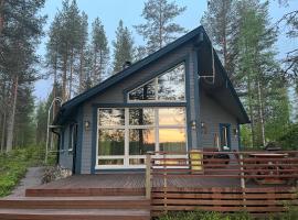 Villa Miilu Iso-Syöte hirsimökki järven rannalla, strandhotel in Syöte
