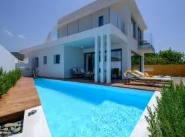 Blue Iris Luxury Beachfront Villa by Nomads - Direct Beach Access & Private Pool