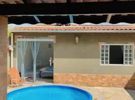 Casa Espaço Sara Piscina Aquecimento Solar total privacidade, área gourmet completa com churrasqueira fogão a lenha, a 5min do centro e do parque das águas