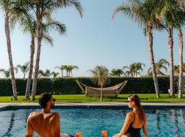 TAF Villas Beach Resort with TESLA, מלון בטיגאקי