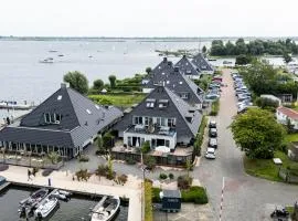 Spacious Water Apartment with Terrace & BBQ Garden in Offingawier