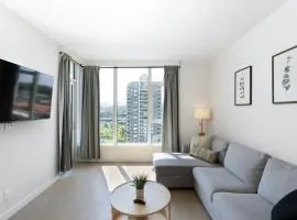 Modern 1BR Condo, Sleeps 4 with Views, AC, Balcony, Near SkyTrain