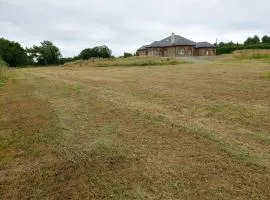 Tent space on grass showers & toilet inside