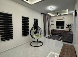 Azlynie Homestay ค็อทเทจในคันการ์