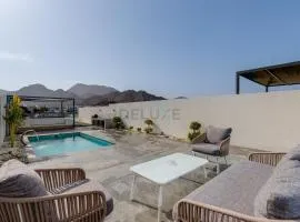 Blue Marble Beach 4BR Villa with Assistants Room, Private Pool, Access to Floating Pier, and Sea and Mountain Views, Al Dana Island, Fujairah by Deluxe Holiday Homes