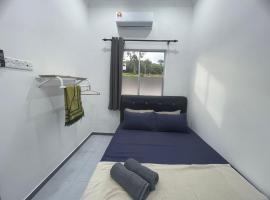 Casa de Alyzaa ชาเลต์ในKampong Lendu