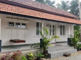 Peaceful 1 BHK country home with open veranda & nature views in Thrissur, Kerala