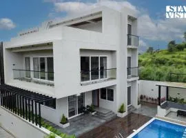 StayVista at Oriana Palms with Wifi and Pool