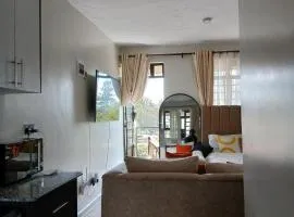 A cozy spacious studio apartment with a balcony