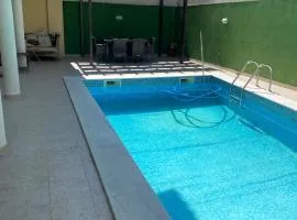 Little double room in a House with pool near the beach