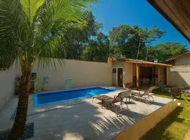 400 m te Separam das Areias da Praia de Boraceia, casa com piscina aquecida para ate 12 pessoas