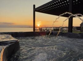 Private beach on a fenced in property sunset views, hotel in Hampton Bays