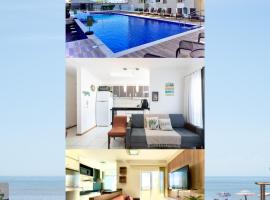 Apartamento a 400M PRAIA com PISCINA sacada com CHURRASQUEIRA privativa Wi-Fi Portaria 24h PLAYGROUND INFANTIL Quadra de esportes e vaga privativa de GARAGEM Reserve agora mesmo, Hotel in Balneário Piçarras