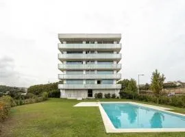 Premium Apartments with Balcony, Pool & Garage by HostWise