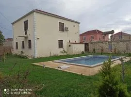 A two-storey cozy house with a pool