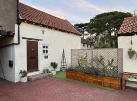 Honey Cottage behind Wilmot House