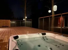 Log cabin with hot tub and views