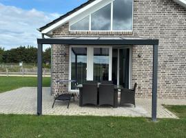 Kuh Blick Ferienhaus Sehestedt, hotel a Sehestedt