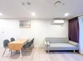 Stylish 2BR City Retreat with Cityscape Views, Pool & Gym