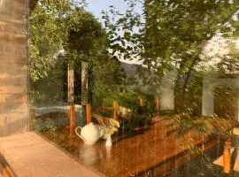Poetic glass house in the countryside
