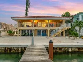 Sunset Harbor Waterfront Villa with Dock Cabana Club