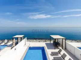 Elegant 4BR Villa with Arabian Gulf, Mountain and Community Views, Assistant Room and Heated Pool, Al Dana Island, Fujairah by Deluxe Holiday Homes