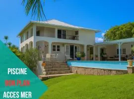 Villa pied dans l'eau Plage de Petit Havre avec piscine