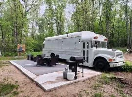 Rustic Converted School Bus with Outdoor Shower Near ORV Trails in Manistee National Forest, Michigan