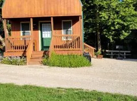 Comfortable Camping Cabins with View of the Cedar River for a Family Weekend Getaway