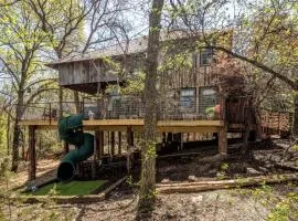 Magical Treehouse with Slide by Brazos River for Family Glamping Adventures in Texas