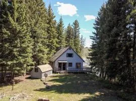 Charming Riverside Cabin with Deck Overlooking Madison River near Three Dollar Bridge in McAllister, Montana