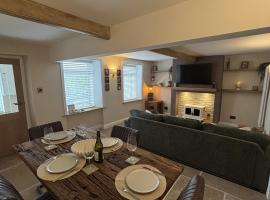 Sunset Cottage - 55 South Lane，位于霍姆弗斯的酒店