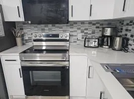 Stylish Basement Suite Near Airport, Trails & Dining