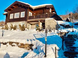 Log cabin at Hafjell, hotel with hot tubs in Øyer