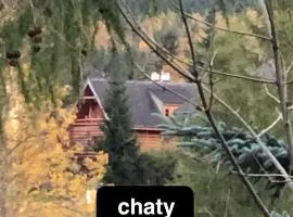 Chaty Świerkowe Wzgórze - domki typu superior z sauną balią kominkiem i domki-bez sauny balii kominka