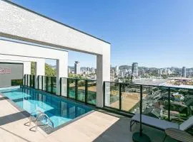 Village Lofts a 5 minutos da Vila Germânica com piscina aquecida no terraço
