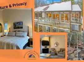 New, Spacious and charming, with a river view, conveniently located near skiing and golf