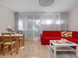 Red Apartment in Wrocław with Two Bedrooms and Desk for Remote Work by Noclegi Renters