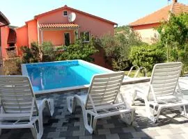 House with outdoor pool in Tisno