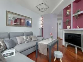Grey and Pink Two Bedroom Apartment in Cracow with Parking, Desk, Terrace and Bathtub by Noclegi Renters
