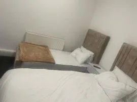 studio apartment with small kitchen and bathroom