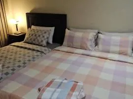 Book a Spacious room with a balcony for your stay with shared bathroom laundry kitchen and living area